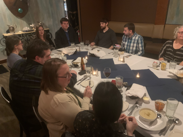 Another view of the other end of the table, showing Tracey, Lee, George, John C and his wife, Katharina, Marion and her husband, and Katy. Food has just started arriving.